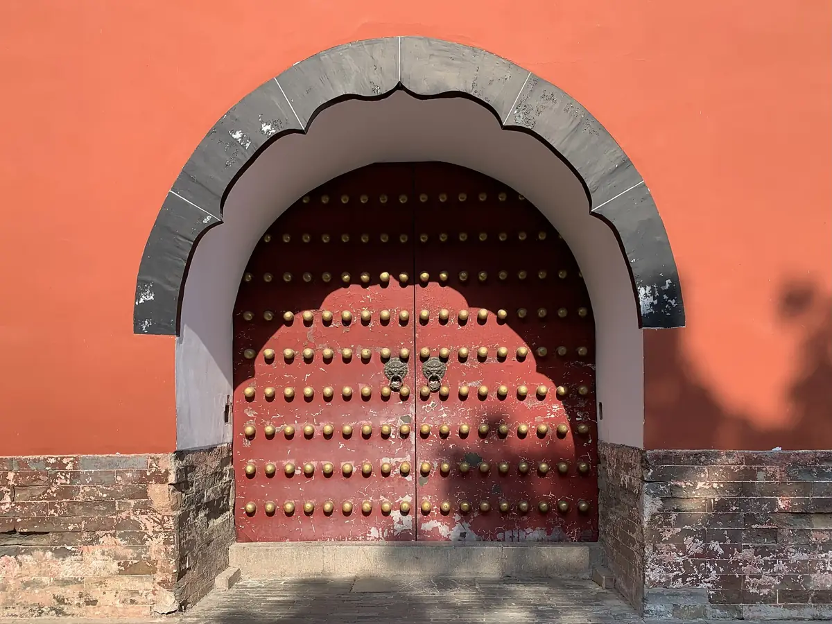 Red walls and an arched gateway at the Ming Xiaoling Mausoleum